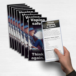 Student holding a Vaping Safe? Think Again fact card.