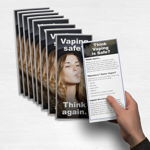 Student holding a Vaping Safe? Think Again fact card.